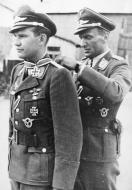 Asisbiz Aircrew Luftwaffe StG2 Hans Ulrich Rudel decorating a member of his squadron 01