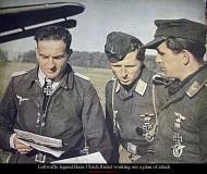 Asisbiz Aircrew Luftwaffe Stuka legend Hans Ulrich Rudel working out a plan of attack