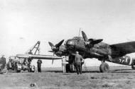 Asisbiz Junkers Ju 88A 1.KG77 3Z+KH being armed with a torpedo Sep 1943 01