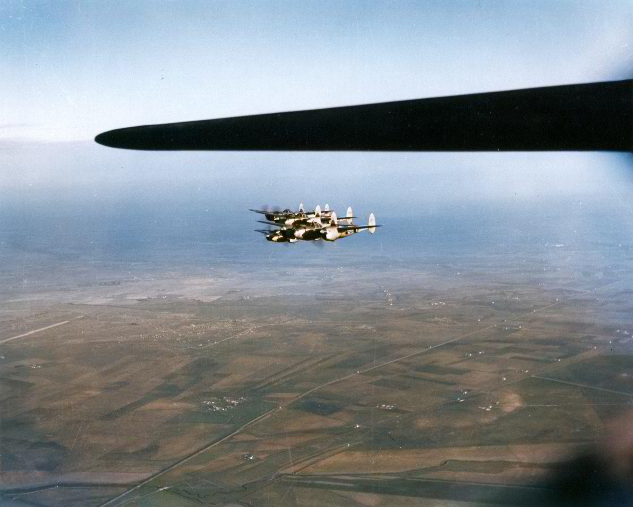 Formation of P-38 Lightnings from 1FG94FS guarding a B 17 Fortress during escort mission somewhere over Italy 15th June 1944 01