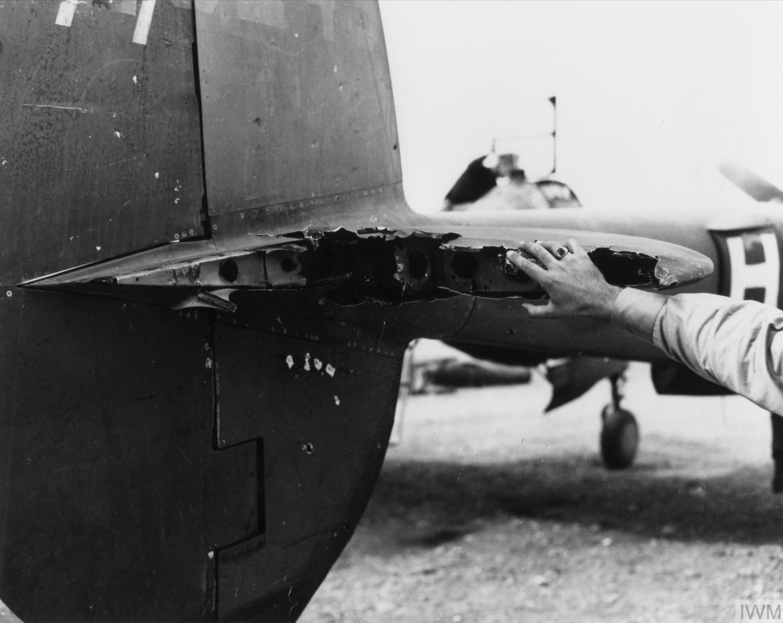 Lockheed P-38 Lightning 15AF 1FG Lt Herbert McQueen P-38 damaged by a 20mm shell plus machine gun bullets FRE9436