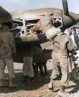 Asisbiz Lockheed P-38 Lightning 12AF 1FG94FS ground crew gives a lift to a fellow LAME undergoing maintenance at an airfield in Sardinia 1943 04