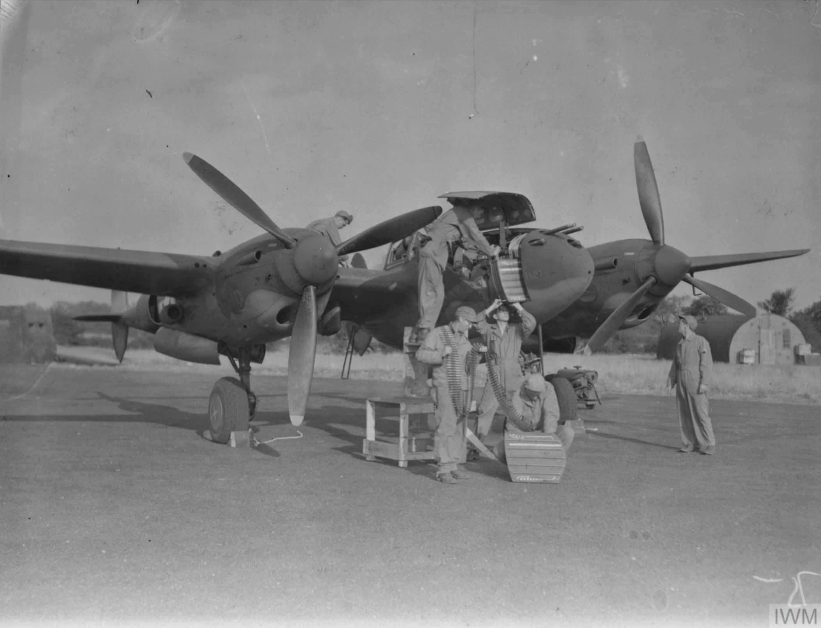 Lockheed P-38H Lightning 8AF 20FG Ground personnel preparing aircraft for their next mission to France October 1943 FRE2396