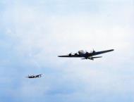 Asisbiz A 8AF 20FG77FS Lockheed P-38 Lightning escorts a 379BG B 17 Fortress to its target in Nazi held Europe Feb 1944 01