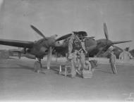 Asisbiz Lockheed P-38H Lightning 8AF 20FG Ground personnel preparing aircraft for their next mission to France October 1943 FRE2396