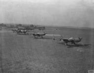 Asisbiz P 38H Lightning 8AF 20FG77FS LC line up for takeoff October 1943 FRE2401