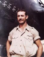 Asisbiz 15AF 82FG96FS ace 2Lt Lawrence P Liebers next to his Lockheed P-38 Lightning when based in North Africa 1942 NARA1