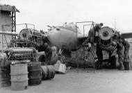 Asisbiz 9AF Lockheed P-38 Lightning mechanics at work repairing aircraft at a forward repair depo Belgium 1944 NARA1