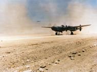 Asisbiz Lockheed P-38 Lightning lands on the dusty airstrip at La Senia Airfield Algeria 1943 NA574