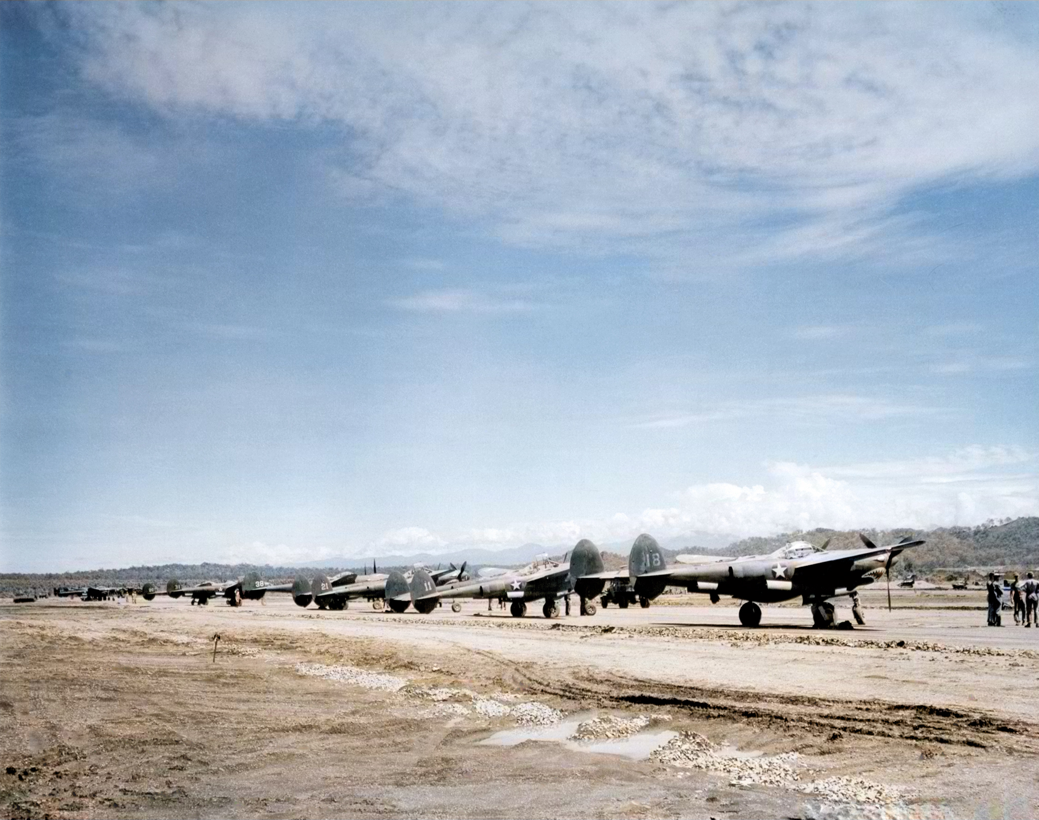 Lockheed P-38 Lightning 35FG39FS lined up on Jackson strip Port Moresby NAID 342 FH 000576
