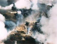 Asisbiz Lockheed P-38 Lightning dropping Napalm over Ipo dam Luzon Philippines 1945 NAID 342 FH 001371