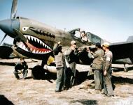 Asisbiz Curtiss P-40E Warhawk 23FG74FS being serviced by Chinese soldiers and armorers at Kunming China 1st Feb 1943 NARA