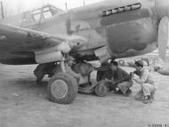Asisbiz Curtiss P 40G Kitty 12AF 324FG ground crew loading a 500lb bomb for Operation Strangle Apulia region Italy April 1944 NARA1
