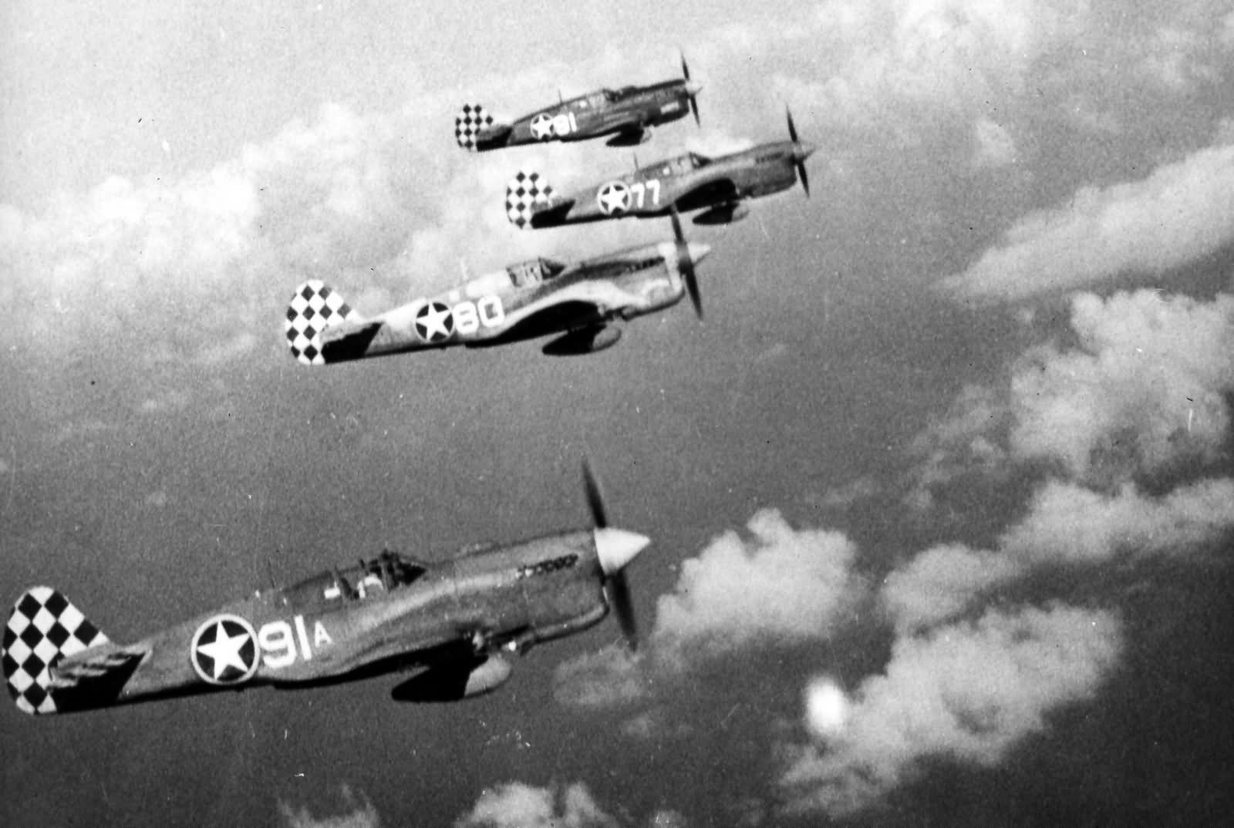 Curtiss P-40L Warhawk 325FG319FS White 91 White 80 White 77 and White 81 on patrol 1943 01
