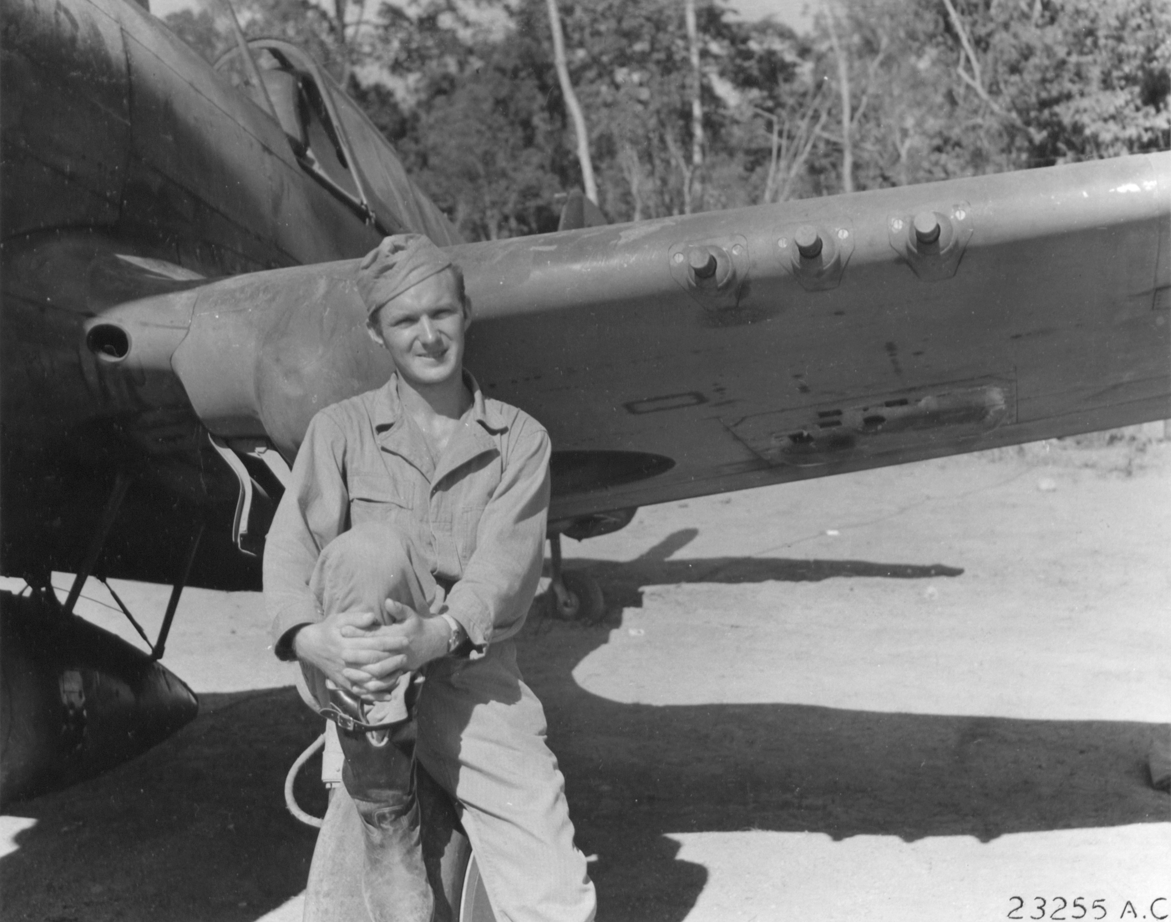 American USAAF 49FG pilot Paul J Slocum beside his Curtiss P-40 Warhawk in New Guinea NA1095