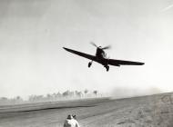 Asisbiz Curtiss P-40E Warhawk 49FG7FS White 51 L Ace taking off Darwin Australia 1942 01