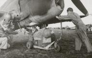 Asisbiz Curtiss P-40 Warhawk 79FG being armed with a 500lb bomb based at Capodichino Italy 11th Apr 1944 01