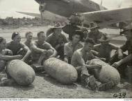 Asisbiz Aircrew RAAF 76Sqn group wishing the Japs a Merry Xmas at Kiriwina Trobriand Papua 26th Dec 1943 AWM OG0439