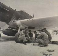 Asisbiz Curtiss P 40N Kittyhawk RAAF 76Sqn ground crew taking shelter Momote Los Negros AWM OG1788