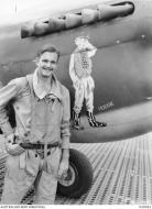 Asisbiz Curtiss P 40 Kittyhawk RAAF 77Sqn FO JAT Hodgkinson at Vivigani Goodenough Island 5th Jul 1943 AWM OG0052