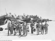 Asisbiz Curtiss P 40N Kittyhawk RAAF 80Sqn pilots returning from their mission Noemfoor DNG 28th Aug 1944 AWM OG1572
