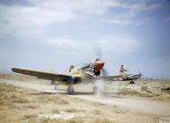 Asisbiz Curtiss Kittyhawk MkIII RAF 112Sqn taxiing at Medenine Tunisia IWM TR978
