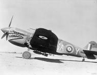Asisbiz Curtiss P 40E Kittyhawk RAF 112Sqn GAY London Pride AK772 lined up at Gambut Main Libya IWM CM2895