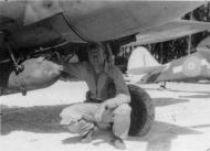 Asisbiz Aircrew RNZAF pilot 18Sqn Ray Archibald checks the 250lb bomb rack 01