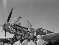 Asisbiz RNZAF ground crew work on the Allison V 12 engine during a visit from NZs Governor General Sir Cyril Newall Ondonga New Georgia