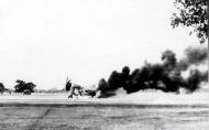 Asisbiz USAAF Republic P 47D Thunderbolt 8AF 404FG aircraft in flames based in France 1944 01