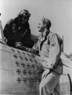 Asisbiz 42 25512 P 47D Thunderbolt 56FG62FS LMQ Penrod and Sam Maj Robert S Johnson being greeted FRE2740