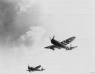 Asisbiz P 47D Thunderbolts 56FG take to the air carrying a 165 gal belly tank and a 500 pound bomb FRE472
