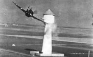 Asisbiz P 47D Thunderbolt 8AF 78th Fighter Group banks past a flak tower whilst strafing ground targets NARA