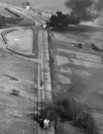 Asisbiz USAAF Republic P 47D Thunderbolt 9AF set ablaze two enemy gasoline trucks and two auxilliary vehicles southeast of Chemnitz