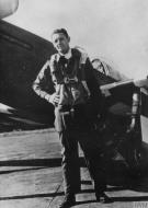 Asisbiz Aircrew USAAF 355FG Lt Alvah G Gilleland standing next to his P 51D Mustang FRE453