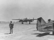 Asisbiz 44 63395 P 51D Mustang 7AF 15FG47FS 157 Daisy Mae with a P 61B Black Widow about to take off at Iwo Jima 6th March 1945 01