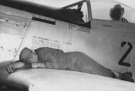 Asisbiz 44 63724 P 51D Mustang 7AF 21FG72FS TSGT Garlan Vaught crew chief listening for Z's Iwo Jima 1945 01