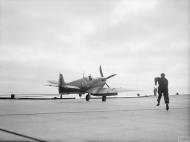 Asisbiz Fleet Air Arm Seafire White L which sustained a puncture on landing on HMS Furious Aug 1944 IWM A25077