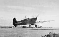 Asisbiz Fleet Air Arm Seafire taking off from HMS Illustrious off Clyde Scotland Feb 1943 IWM A20650