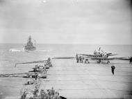 Asisbiz Fleet Air Arm Seafires aboard HMS Furious with cruiser USS South Dakota foreground 6 9th Jul 1943 IWM A17989