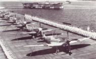 Asisbiz Fleet Air Arm Seafires lined up on deck for a parade 01