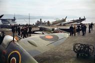 Asisbiz Fleet Air Arm Seafires waiting to be loaded onto their assigned carrier 1942 01