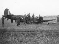 Asisbiz German soldiers capturing a crashed Spitfire 01