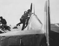 Asisbiz Aircrew RAAF 452 Squadron Bardie stepping into Spitfire 01