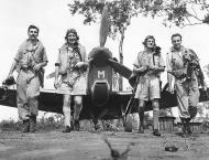 Asisbiz Spitfire MkVcTrop RAF 54Sqn DLM SLdr EM Gibbs with Cavanagh Norwood and Thompson Australia late 1943 01