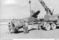 Asisbiz Spitfire IX RAF 154Sqn HTC EN356 being salvaged Malta Jul 1943 AWM MEC2047