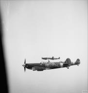Asisbiz Spitfire MkVb RAF 303 Polish RFH BM144 escorting a B 17 carrying Montgomery 17th May 1943 IWM 01
