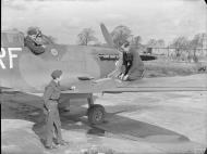 Asisbiz Spitfire MkVb RAF 303 Polish Sqn being rearmed at RAF Northolt IWM CH5506