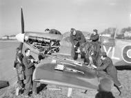 Asisbiz Spitfire LFVB RAF 322Sqn being rearmed at Hawkinge Feb 1944 web 01