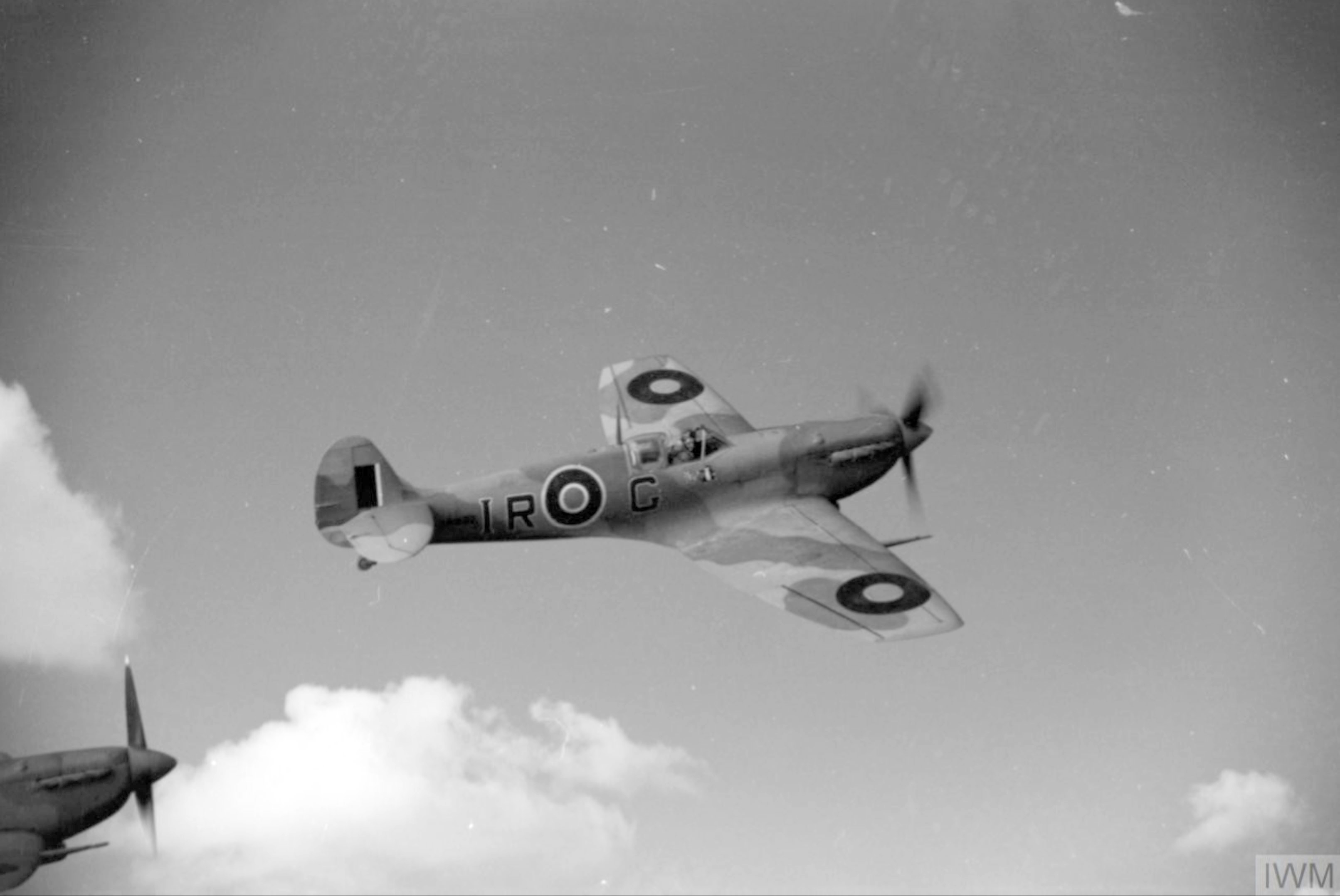 Spitfire LFVb RAF 244 Wing IRG AB502 over the Tunisian coast IWM CNA816